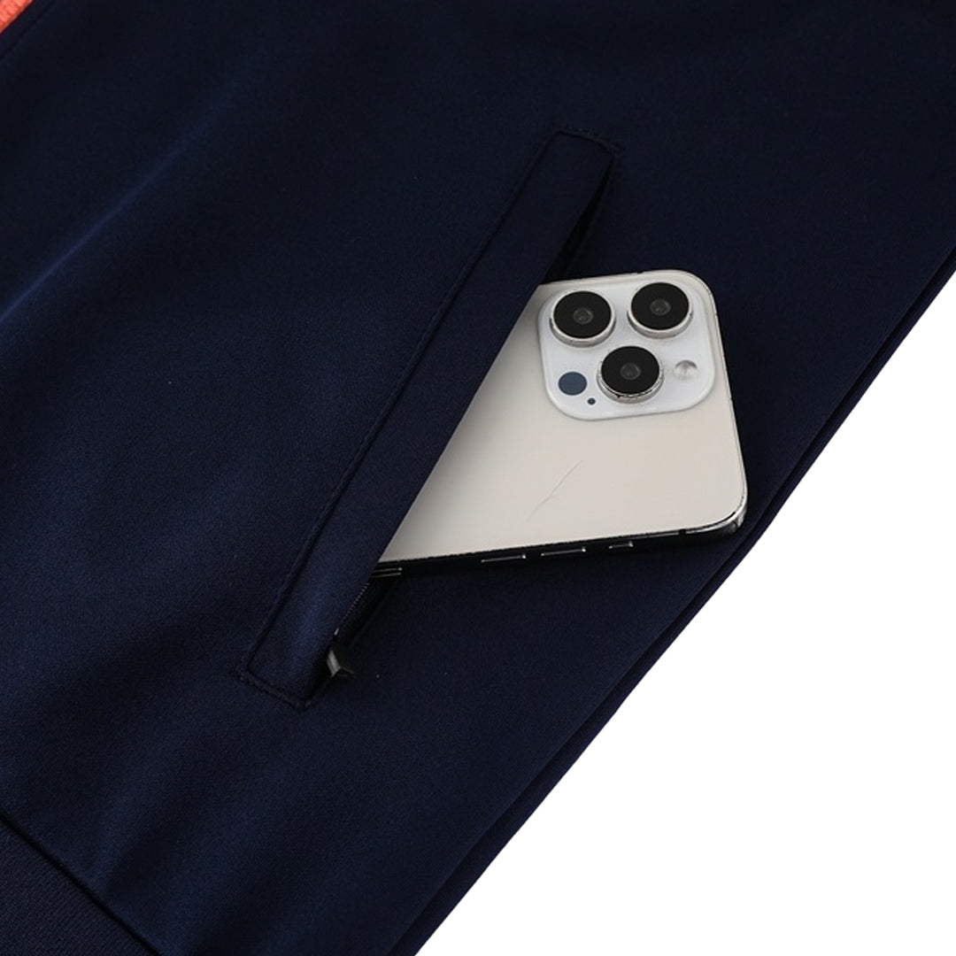 Kit de entrenamiento del Barcelona 25/26 (Chaqueta + Pantalón) Azul Marino y Naranja