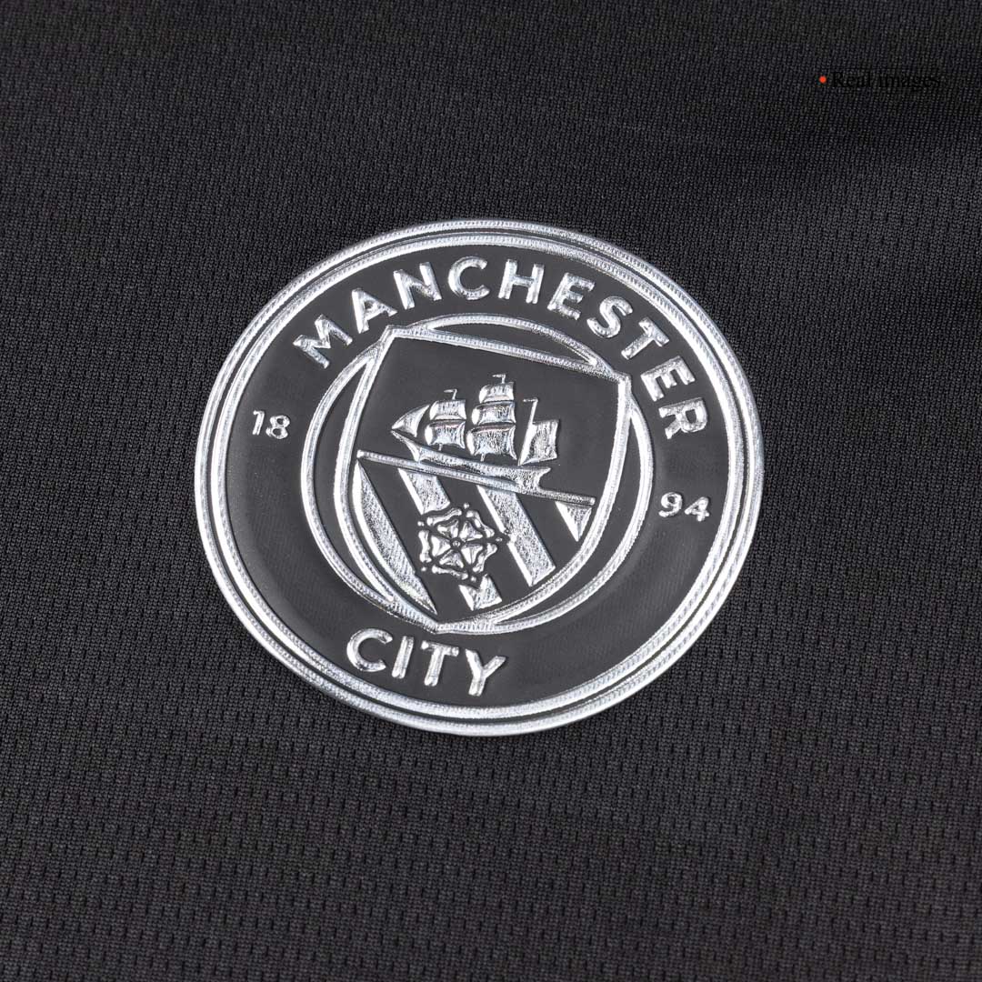 Kit de visitante del Manchester City (camiseta, pantalón corto y medias) 2025/26